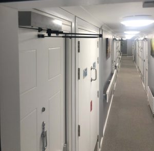 Auto-closer close-up and Emergency Lighting in corridor