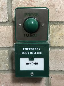 Press to Exit and Emergency Door Release close-up