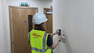 Female operative scanning QR Code for Waking Watch